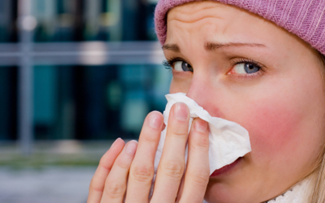 young female having a cold