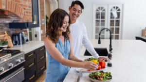 Apple cider vinegar health benefits and uses, couple making salad