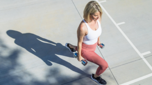 Middle age female lifting weights and weight training