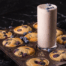 Side-by-side comparison of a blueberry muffin and IsaLean Plant-Based Blueberry Muffin Protein Shake highlighting nutrition differences.