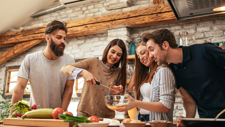 Two couples cooking with Collagen Bone Broth