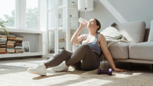 Woman drinking water after working out